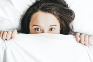Blogs 2 woman under covers min